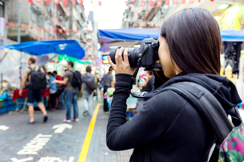 Tourist taking photo with camera